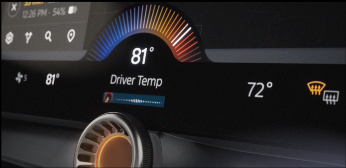 Existing vehicle UI showing climate and media control interface with jog dial interaction diagram