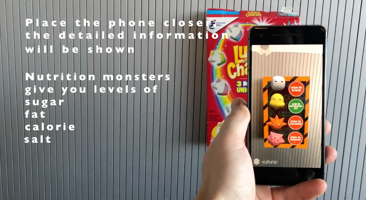 A hand holds a phone over a cereal box; the AR view shows monster characters rating the sugar, fat, calorie, and sodium levels